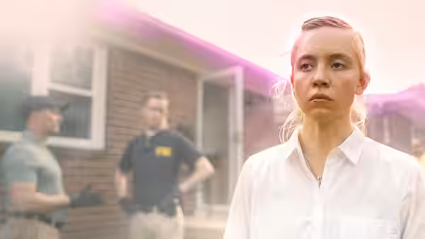 Reality Winner (Sydney Sweeney) looking concerned outside her house with agents nearby