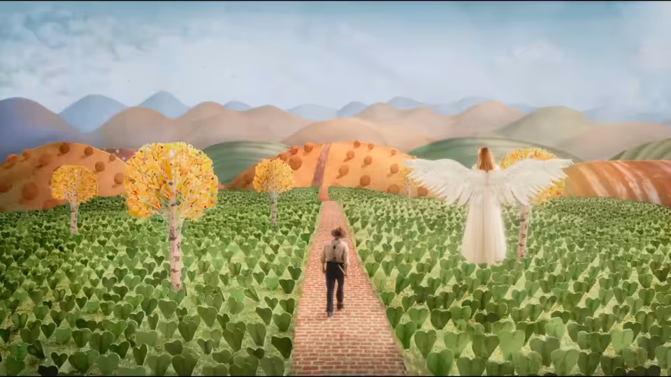a man walking a brick path toward a winged figure across a painted landscape