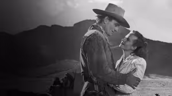 Matthew Garth (Montgomery Clift) embraces Tess Millay (Joanne Dru) on the open range