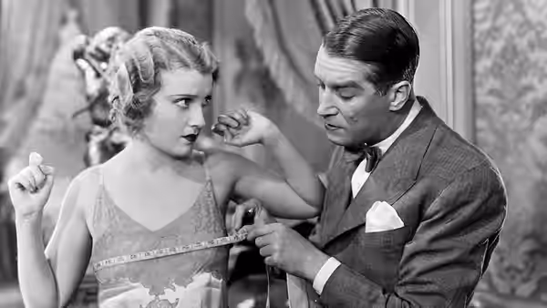 Maurice Courtelin measures Princess Jeanette's waist with a tape measure