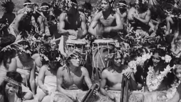 Islanders gather in rows, some seated and others standing behind them