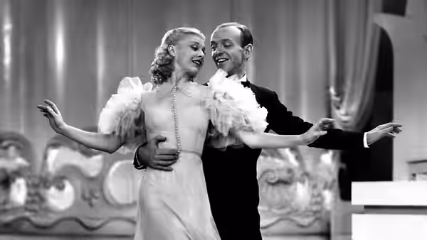 Lucky Garnett (Fred Astaire) and Penny Carrol (Ginger Rogers) dance with arms outstretched
