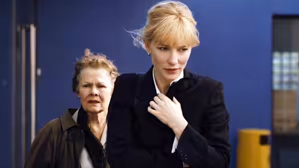Sheba Hart (Cate Blanchett) walks ahead of Barbara Covett (Judi Dench) outside