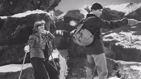 Martin Breitner (James Stewart) points across the snowy mountains as Freya Roth (Margaret Sullavan) stands beside him