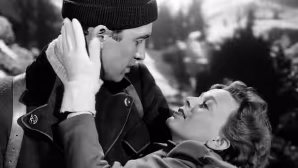 Martin Breitner (James Stewart) leans over Freya Roth (Margaret Sullavan) in the snow