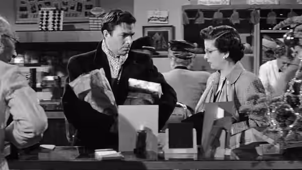 Martin Donnelly (James Mason) and Lucia Harper (Joan Bennett) meet at a department store counter