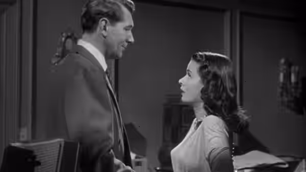 Mark Lamphere (Michael Redgrave) faces Celia Lamphere (Joan Bennett) in a bedroom
