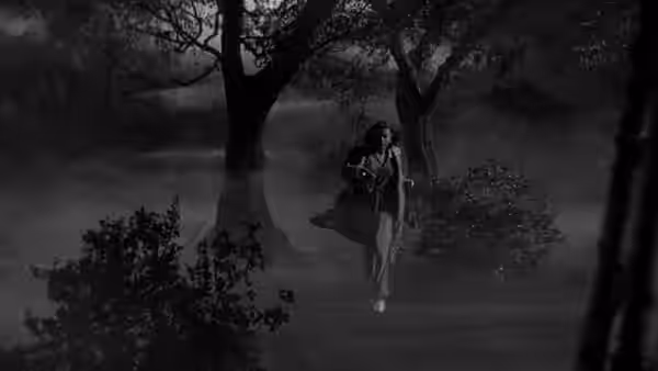A woman in a pale dress sits on a tree branch at night