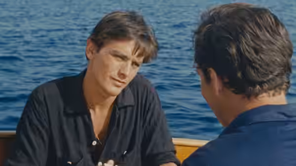 Philippe Greenleaf (Maurice Ronet) talks with Tom Ripley aboard a boat