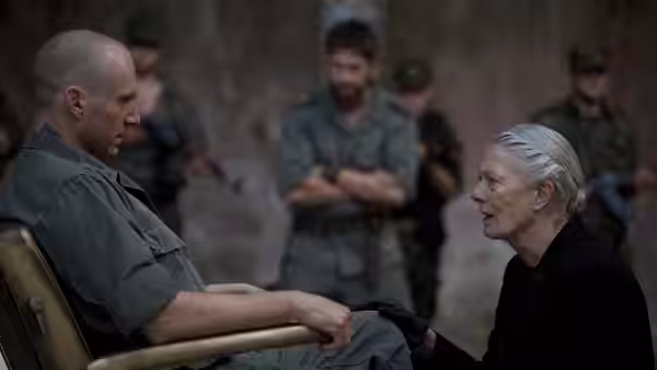 Coriolanus (Ralph Fiennes) sits facing Volumnia (Vanessa Redgrave) in a derelict room