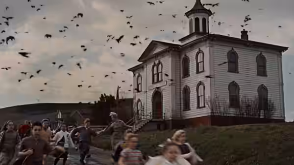Children flee beneath a sky crowded with birds outside a large school