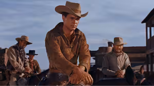 Colorado Ryan (Ricky Nelson) riding in front of other cowboys