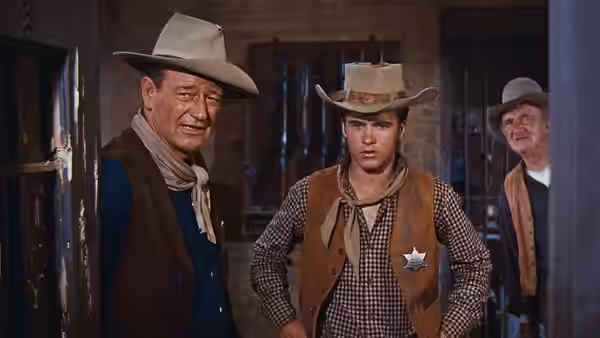 Colorado Ryan (Ricky Nelson) standing between two older men