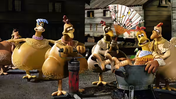 Chickens operating machinery and holding a fan inside the coop