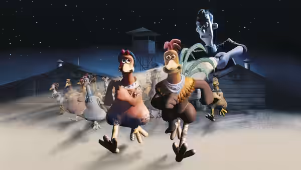 Chickens running across snowy ground at night led by a rooster