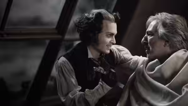 Sweeney Todd (Johnny Depp) confronting Judge Turpin (Alan Rickman) in a dark room