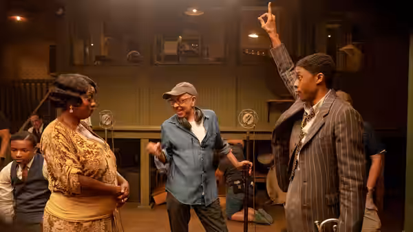 Ma Rainey (Viola Davis) faces Levee (Chadwick Boseman) as he raises a finger in the studio