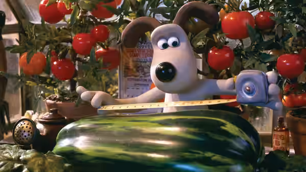 Gromit measuring an enormous vegetable with a tape in a greenhouse