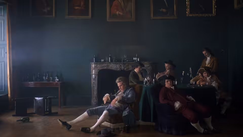 Men in period clothing gather around a table in a dark paneled room