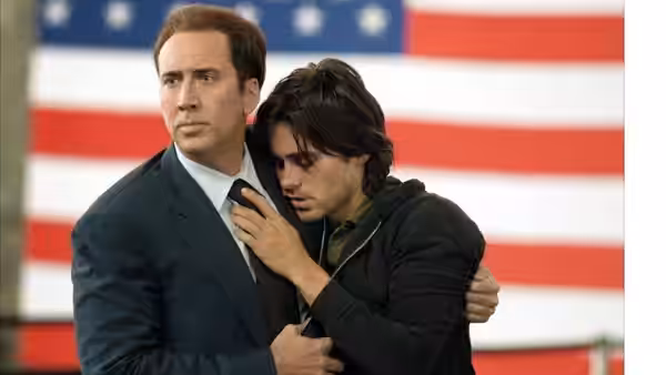 Yuri Orlov (Nicolas Cage) embraces Vitaly Orlov (Jared Leto) before an American flag