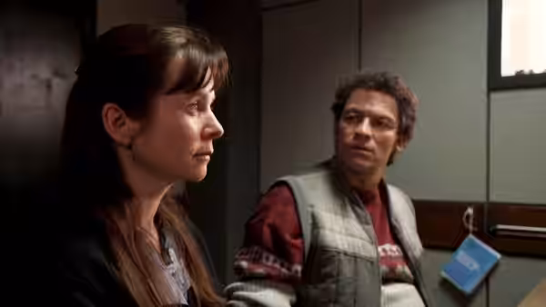 Janet Leach (Emily Watson) listens as Fred West (Dominic West) speaks in an interview room