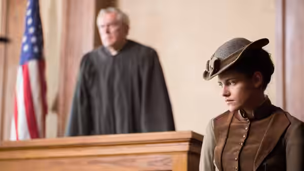 Lizzie Borden (Chloë Sevigny) sits in court as a judge presides