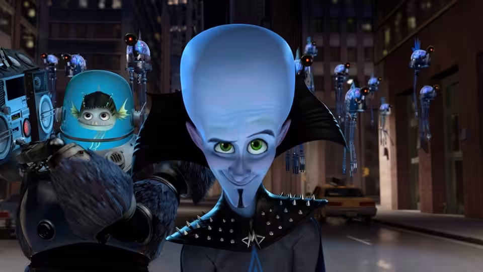 Megamind (Will Ferrell) grins in a city street as Minion (David Cross) watches from his glass orb