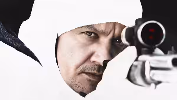 Cory Lambert (Jeremy Renner) peers through a rifle scope in close-up