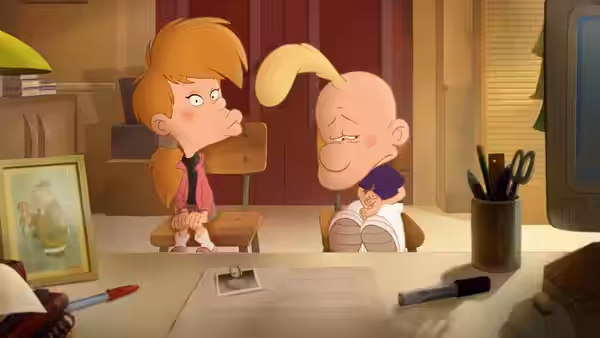 Titeuf sitting beside a girl in a classroom at school