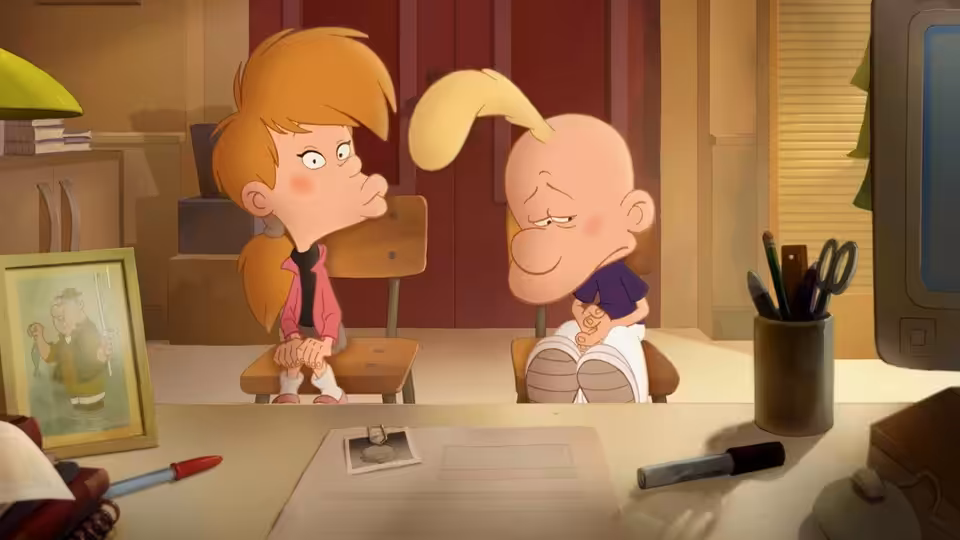 Titeuf sitting beside a girl in a classroom at school
