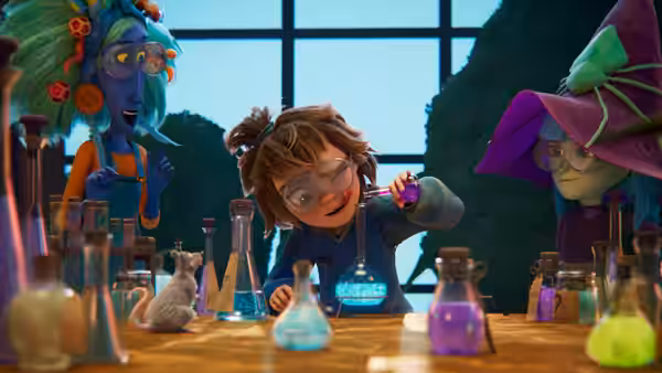 Girl pipetting liquid into flask at lab table while others observe nearby