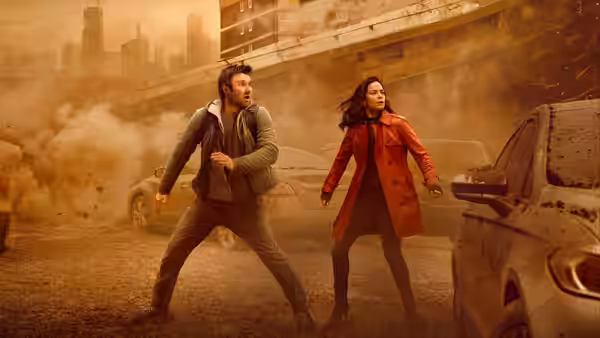 Joel Edgerton and Jennifer Connelly brace themselves amid a dusty city