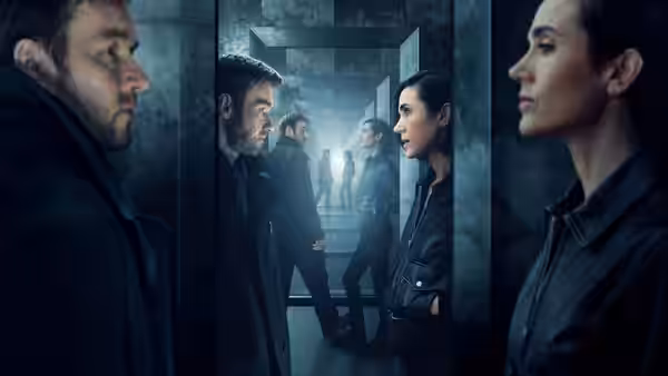 Joel Edgerton faces Jennifer Connelly in a dimly lit concrete corridor