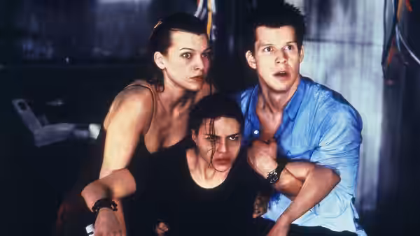 Alice (Milla Jovovich) with Rain and Matt in a dark room