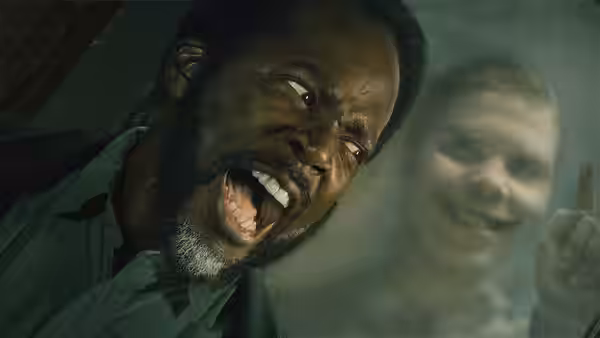 Boyd Stevens (Harold Perrineau) shouting as a smiling woman gestures behind him