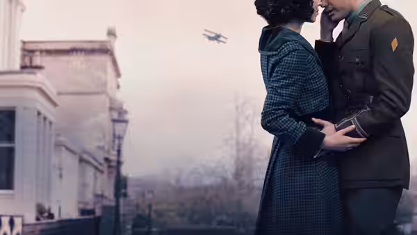Couple embracing on a street with an airplane flying overhead