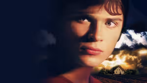 Clark Kent (Tom Welling) gazes forward against a dramatic sunset sky