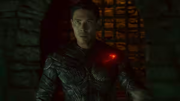 Liu Kang (Ludi Lin) in dark armor with a red light on his chest