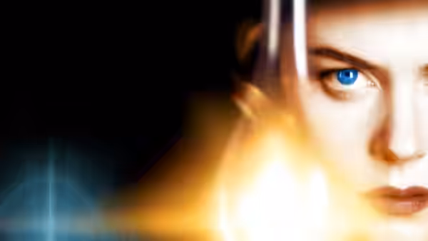 Close-up of Grace Stewart's (Nicole Kidman) blue eye beside a glowing flame