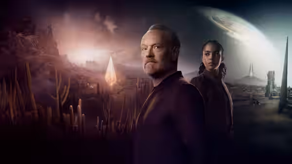Hari Seldon (Jared Harris) stands with Gaal Dornick (Lou Llobell) in a desert