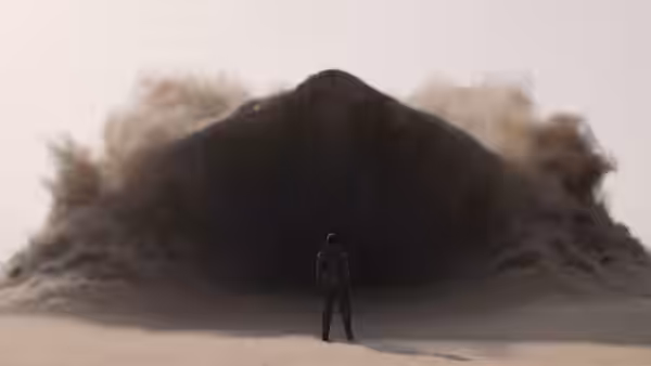 A solitary figure confronts a towering wall of sand and dust