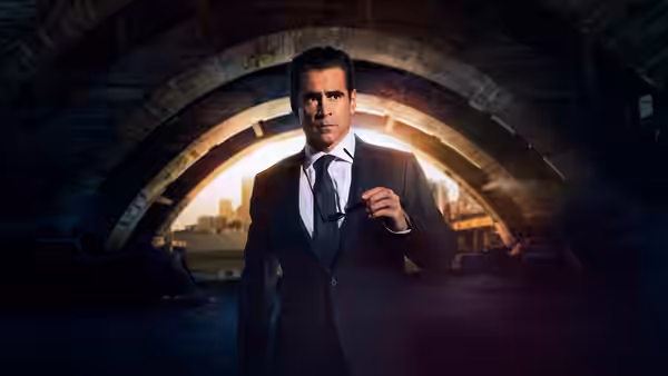 John Sugar (Colin Farrell) holding sunglasses under a concrete overpass