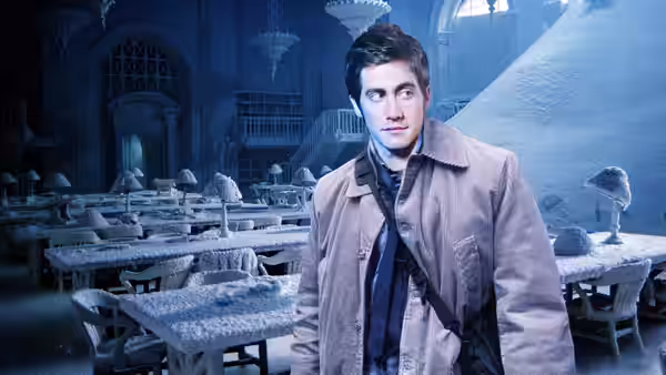 Sam Hall (Jake Gyllenhaal) standing amid snow-covered desks in a frozen hall