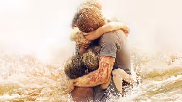 A man embraces a woman and child in chest-deep floodwater