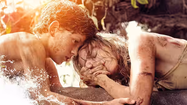 Lucas Bennett (Tom Holland) holds his injured mother above the floodwater