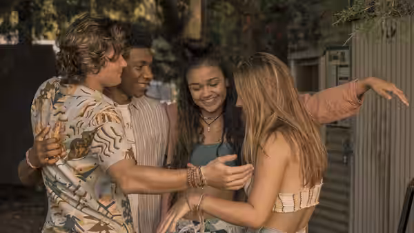 JJ, Pope, Kiara and Sarah sharing a group hug outdoors