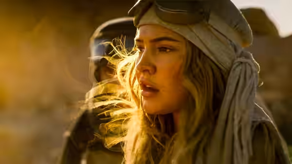 Sarah Cameron (Madelyn Cline) with headscarf in a windy desert