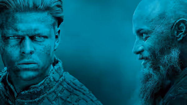 Two Viking men staring intently in a blue-lit setting
