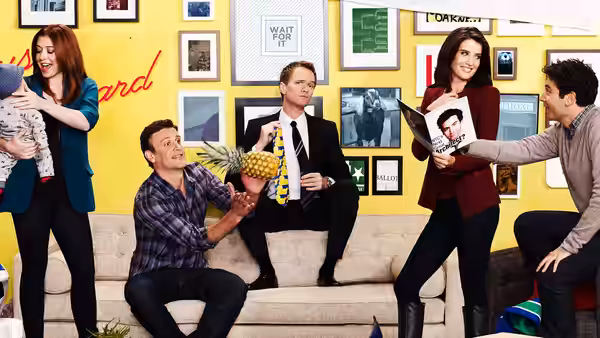 Lily holding a baby while Marshall offers a pineapple to Barney and Robin