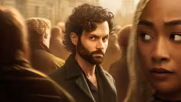 Joe Goldberg (Penn Badgley) standing amid a bustling city crowd